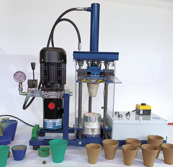 1 Coffee to-throw cup press with 3D printed prototypes and pressed greenware cups.
