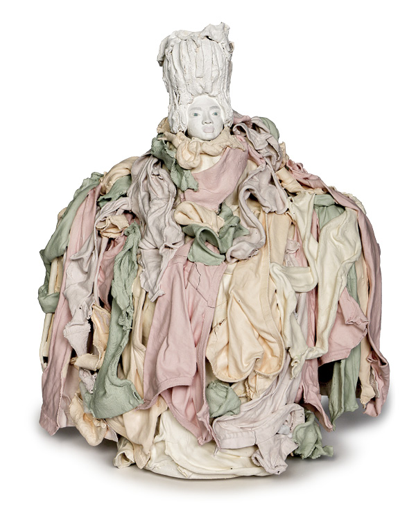 Shana Twardzik-Heine’s Horde Couture, 15 in. (38.1 cm) in height, head: hand-sculpted paper clay, underglazes; fabric and wig: old t-shirts, socks, underwear dipped in colored slip, mid-fired, 2025.
