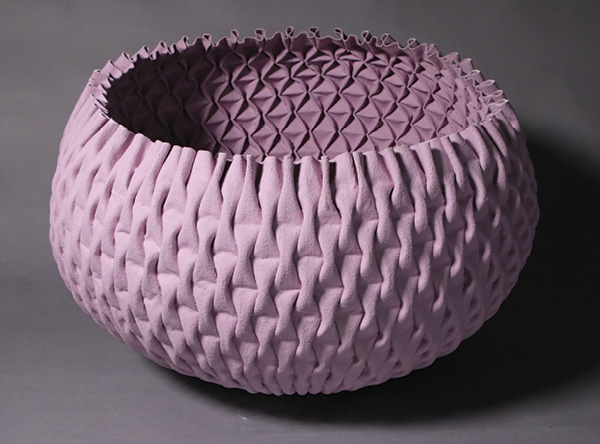 Sukanjana (Eve) Kanjanabat’s Threaded Porcelain #26, 25 in. (63 cm) in diameter, porcelain, fabric, colored stain, fired in oxidation to 2264°F (1240°C), 2026. Photo: Huang Yu Min.