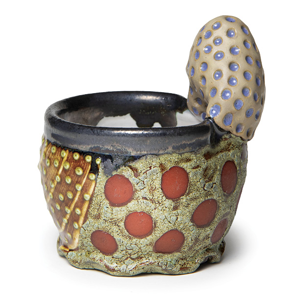 2 Ronan Peterson’s bowl, 5½ in. (13.9 cm) in height, red earthenware, terra sigillatas, glazes, fired to cone 03 in an electric kiln.
