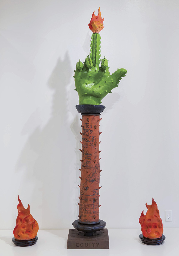 5 Salvador Jiménez-Flores’ A Hand Gesture to Systemic Racism: Al que le quede el saco que se lo ponga, 8 ft. (2.4 m) in height, earthenware, stoneware, black stain, underglaze, glaze, wood, steel, graphite, latex paint, 2021.