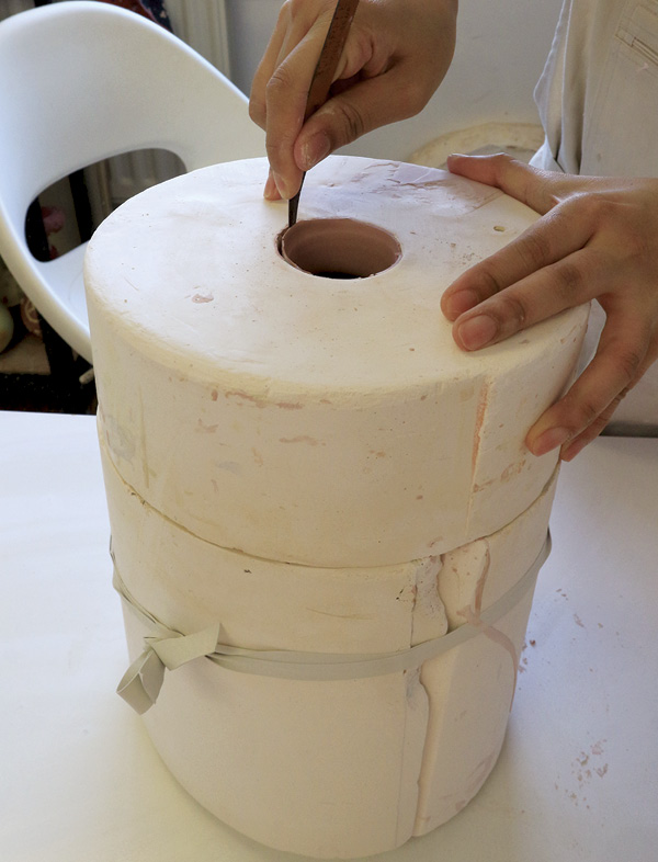 10 Trim the excess clay at the pouring opening; this also helps when opening the mold.