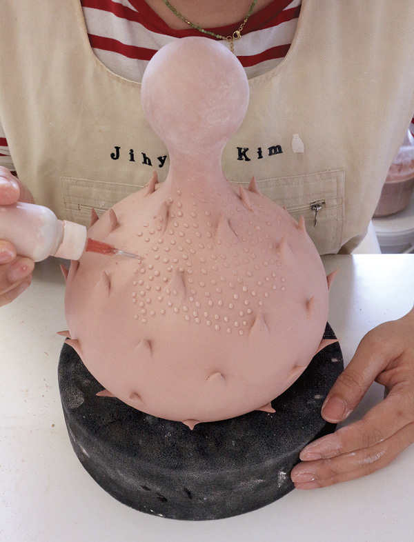 17 Apply small dots to the surface using a slip trailer. Once the surface decoration is complete, bisque fire your vessel.
