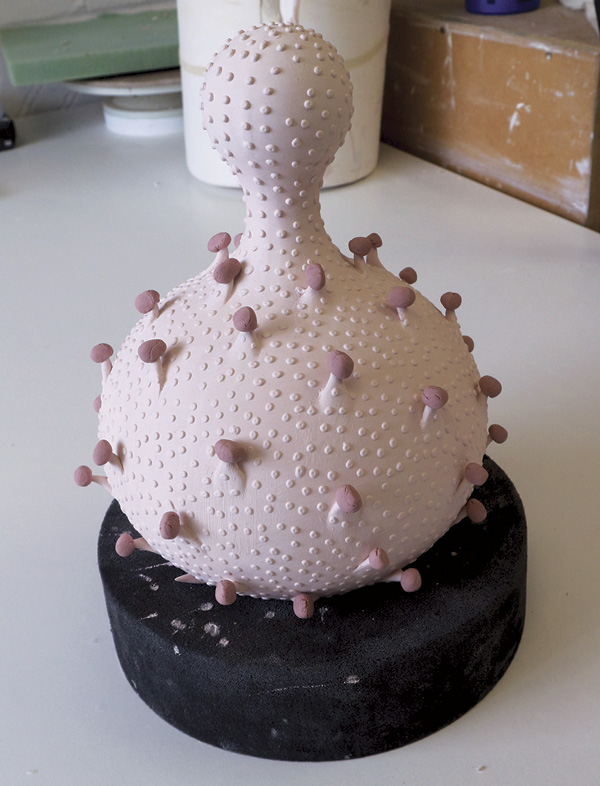 21 View of the vessel right before the glaze firing, showing the gloop glaze perched on each spike.