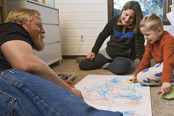 5 Perry, wife Iva, and son Marko spend time drawing together at home.