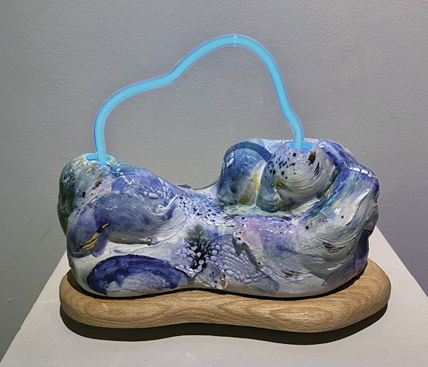 2 Ling Chun’s The Flowing Glacier, 13 in. (33 cm) in length, wood, ceramics, neon, 2025.