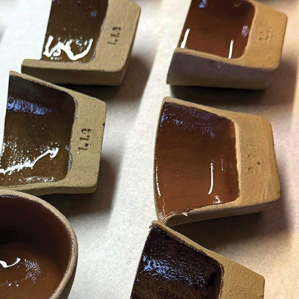 1 Across the table in Fabrikaat Studio’s lab, waterproof bio-based coating tests show a range of hues and gloss values.