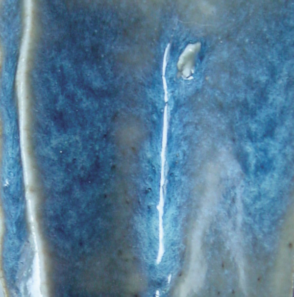 4 Gerstley borate used in a cone-6 oxidation glaze resulting in a typical variegated blue/white effect.