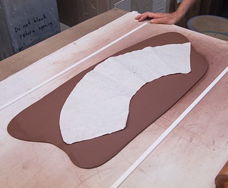 1 Lay the paper template over the smoothed out slab.