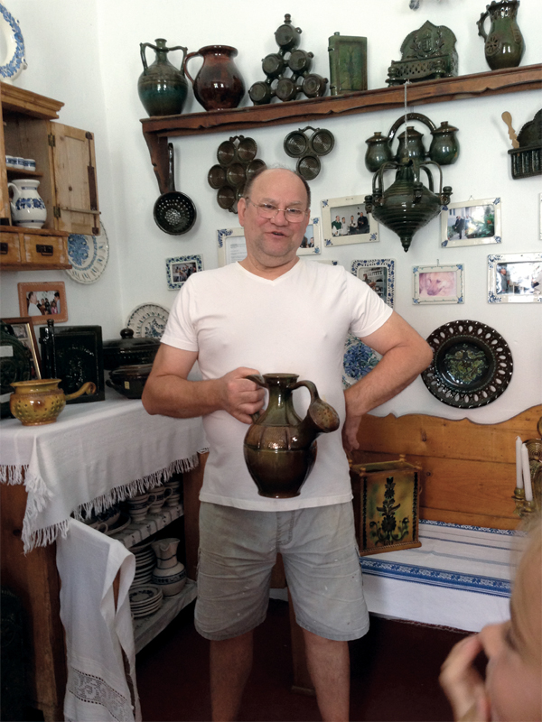 13 Sándor Ambrus with a Tabáni style watering vessel, 14 in. (36 cm) in height, Regional clay body, fired to 1796°F (980˚C) in an electric kiln. Photo: Elizabeth Balla. 