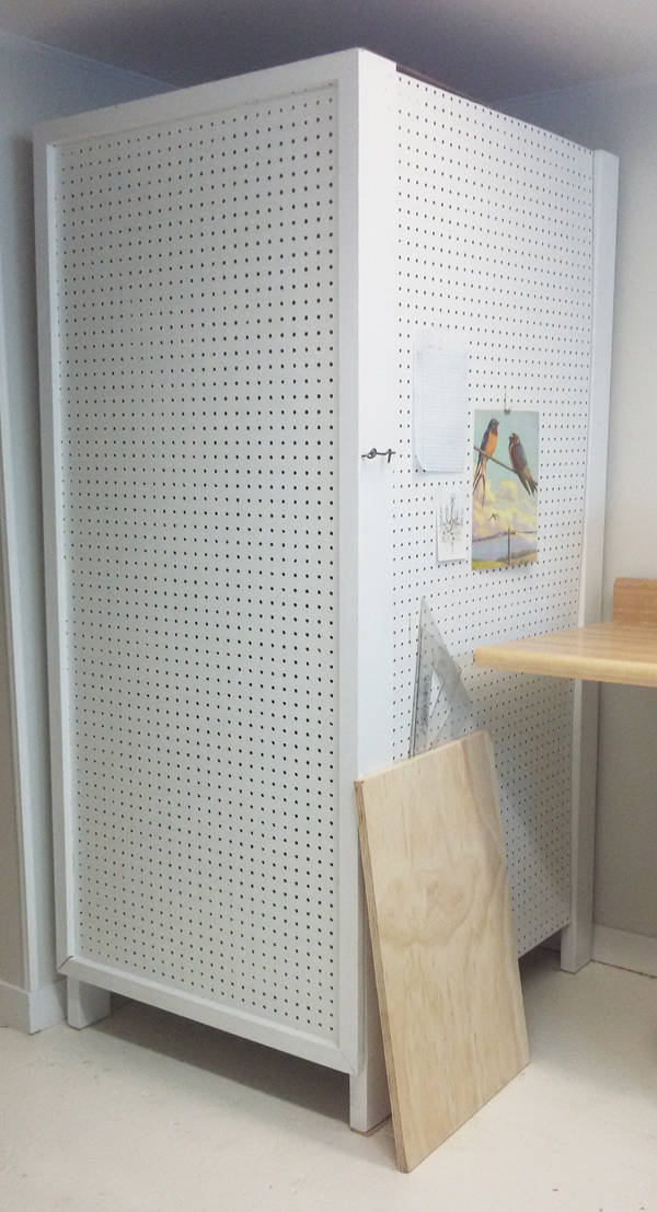 The finished ware rack is kept closed with a simple hook-and-eye lock. The pegboard adds an area for inspirational images to be added.