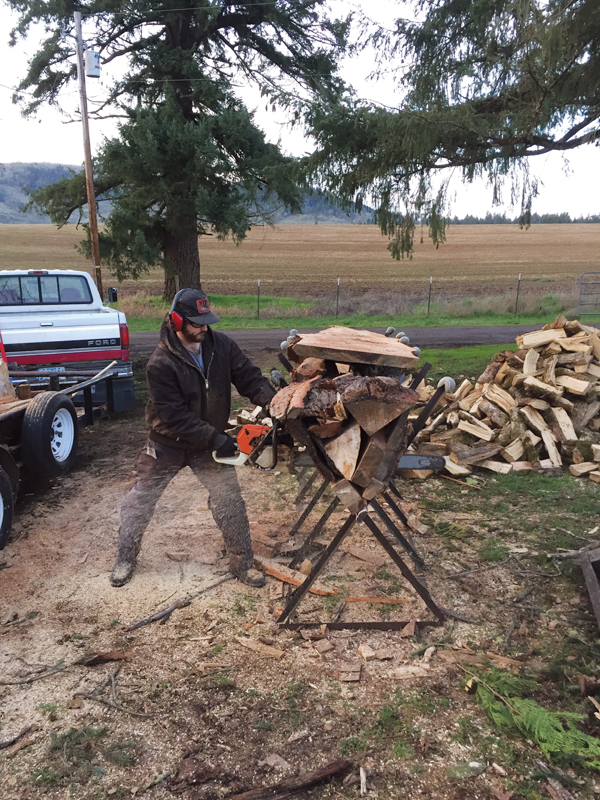 3 Jonathan Steele cutting wood down to 24 inches in length.