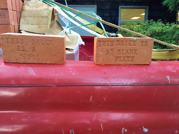 2 Two of the community bricks given to Arrowmont UCVII attendees: “This Brick is a Tool” and “This Brick is a Blank Slate” pictured on top of Copus’ pick-up truck.