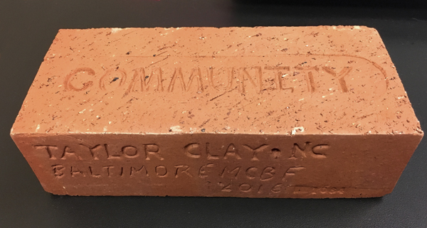 1 The brick I brought back from the symposium. Each brick has the word community stamped on it, as well as information on the makers, the clay used, and where it was made.