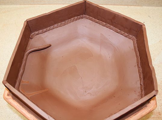 6 To create a deeper bowl, add slab sides and reinforce all joins using soft, thin coils.