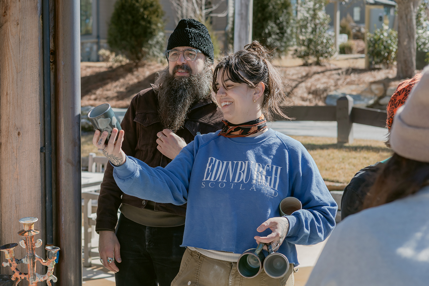 Image of students unloading the soda kiln at the Bascom