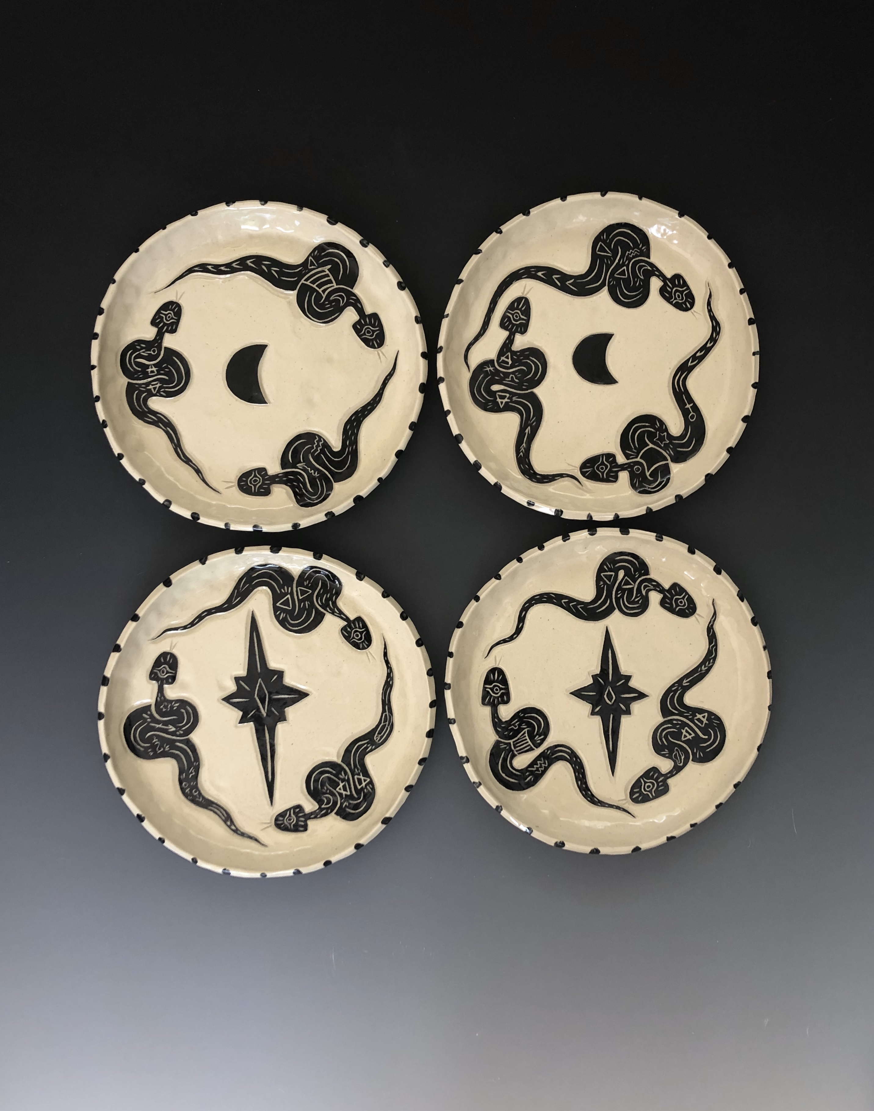 Caroline Elliott’s snake dinner plates, 8 in. (20 cm) in length each, stoneware, fired to cone 5, 2021.