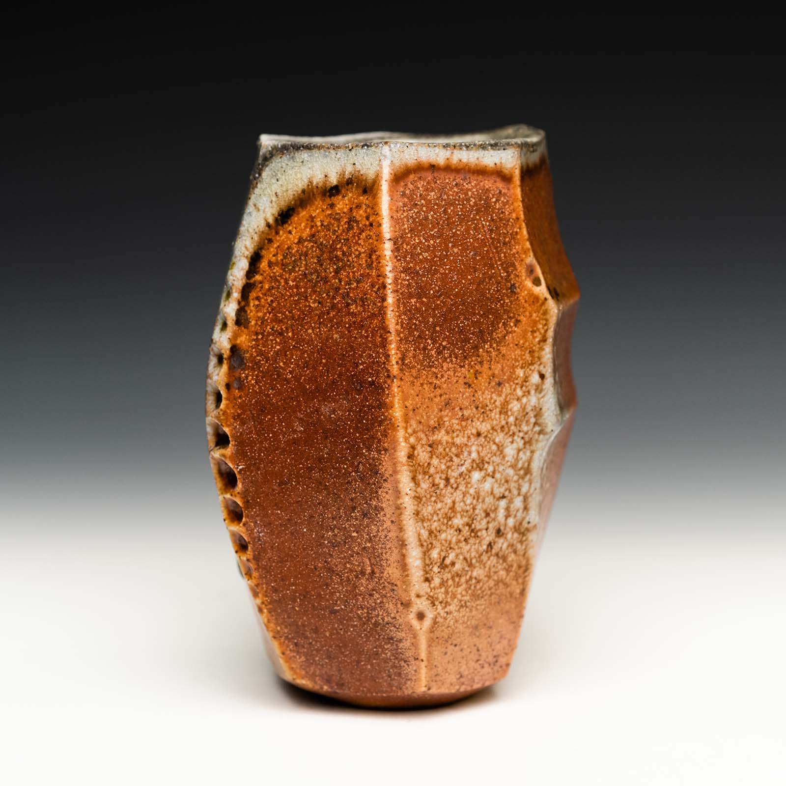 Alex Olson, yunomi, 5 in. (13 cm) in height, B-mix clay with grog, shino liner glaze, wood fired to cone 10 in reduction, 2021.