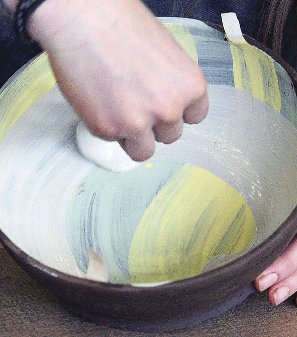 2 Apply layers of underglaze to the base. These layers can be blotchy to allow the richness of the clay to come through.