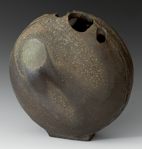 Quarry Moon Vase, 15 in. (38 cm) in diameter, stoneware, natural-ash glaze, inspired by the bore holes in a Tasmanian quarry, 2020. Photo: Warren Frederick.