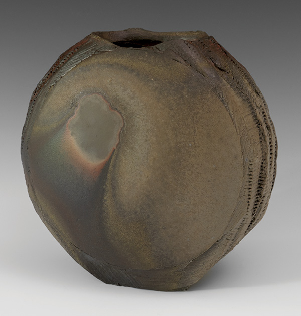 Flattened Moon Vase, 2023. Stoneware, natural-ash glaze, fired in an anagama to cone 10 to 13. Photo: Warren Frederick.