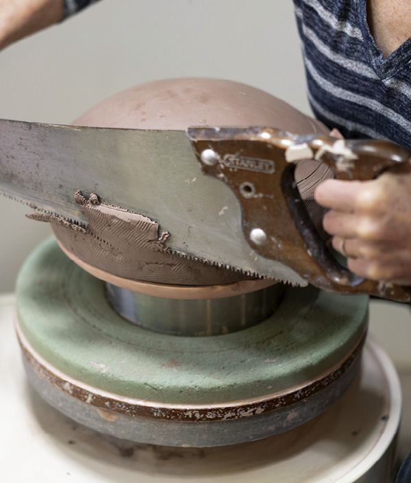 14 Use a flexible cross-cut saw to facet the sides. Embrace the fruitful tension of using a large rough tool with finesse to achieve a texture that contrasts with the graceful feeling of the smooth curve.