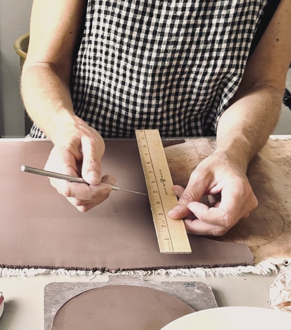 1 Roll, measure, and cut out slabs: cut a lid, a top for the lid, a base, and cylinder for the base.