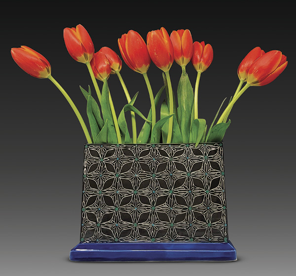 Matt Conlon's finished flower brick, holding red tulips.