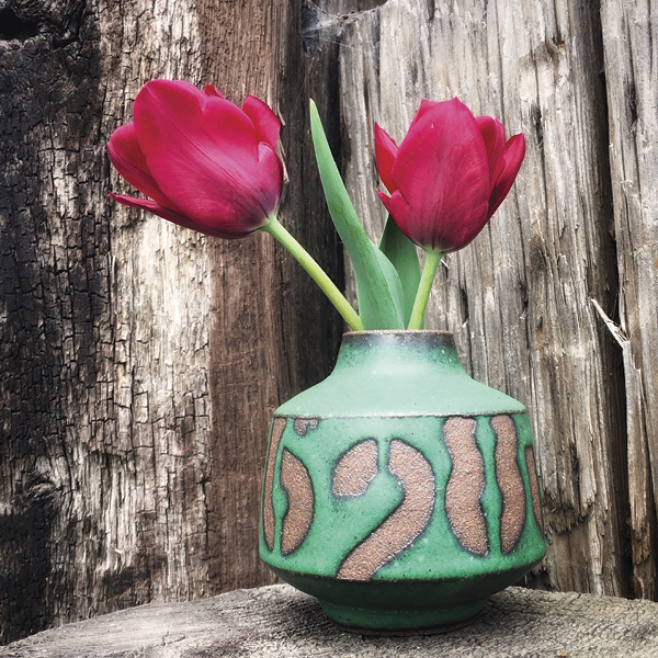 Industrial-inspired rocking vase by Rebecca Sabo.