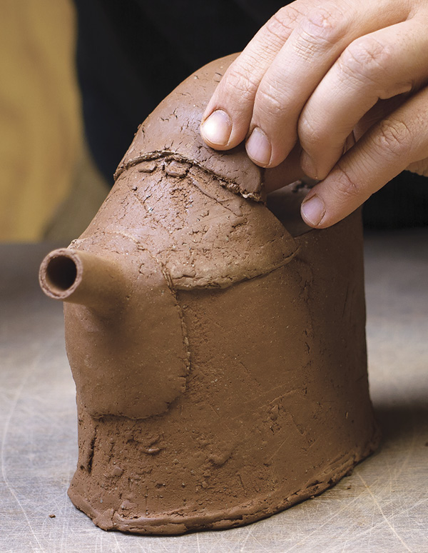 14 Trim the handle length and shape the ends to match the contours of the pot.