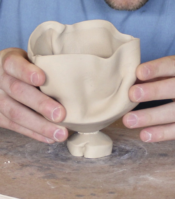 5 When adding a foot, keep the cup level. Imagine how the cup will fill with water to ensure it remains stable when in use.