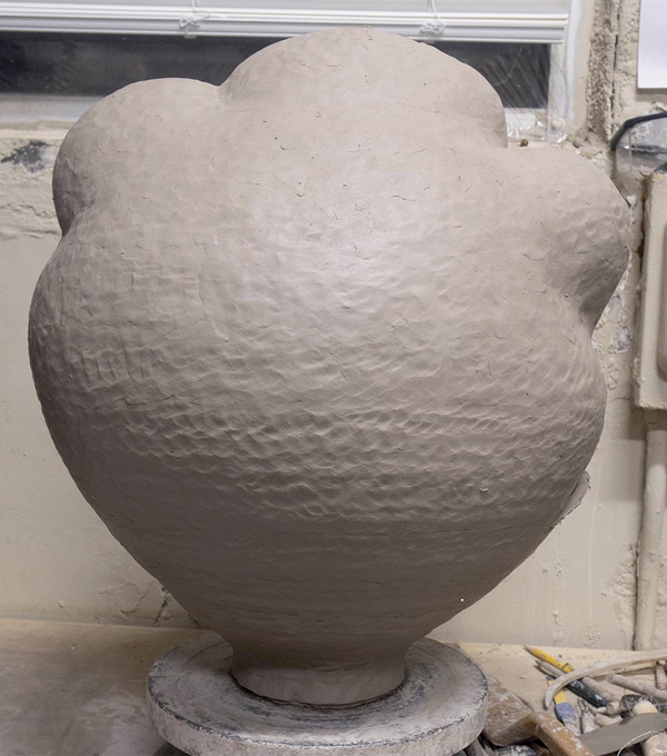 1 I start by either throwing or handbuilding a sculptural form. This one is inspired by a Korean moon jar.