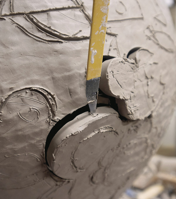 3 Use a knife to cut portions of the drawn lines, this allows you to push out the wall and create different depths of relief.