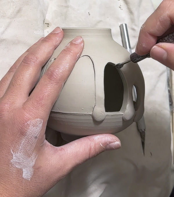 4 Remove the cut sections. Use carving tools, sponges, and brushes to refine the inside edges and add details.