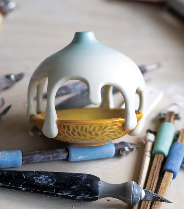 6 Glaze the drips on the top section and the dish on the bottom with colors that separate them.