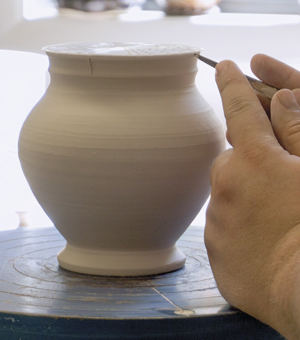 1 Divide the trimmed, leather-hard form symmetrically into four sections. If the clay is too dry, the coils may crack.