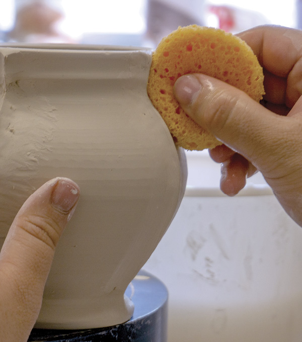 3 Use a damp sponge to refine each coil. Use very light pressure and as little water as possible.