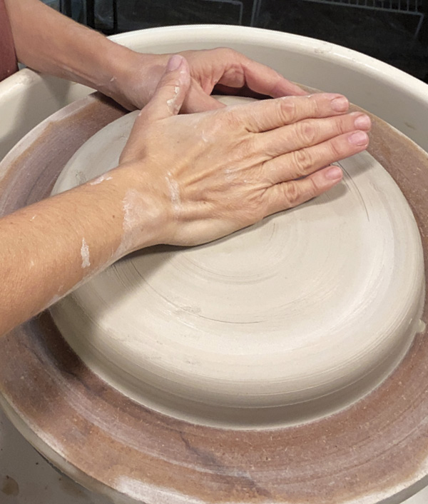 1 Center a low flat disk, roughly 10 inches (25.4 cm) wide and 1 inch (2.5 cm) thick.