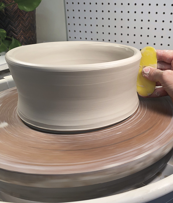 5 Remove excess water and slurry from both sides of the vertical wall.