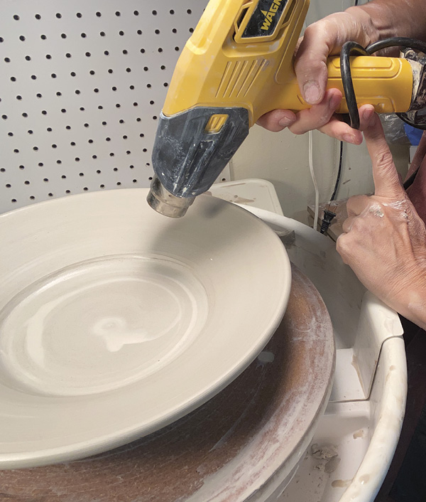 8 Apply a heat gun evenly over the plate form to firm it up for the next step.