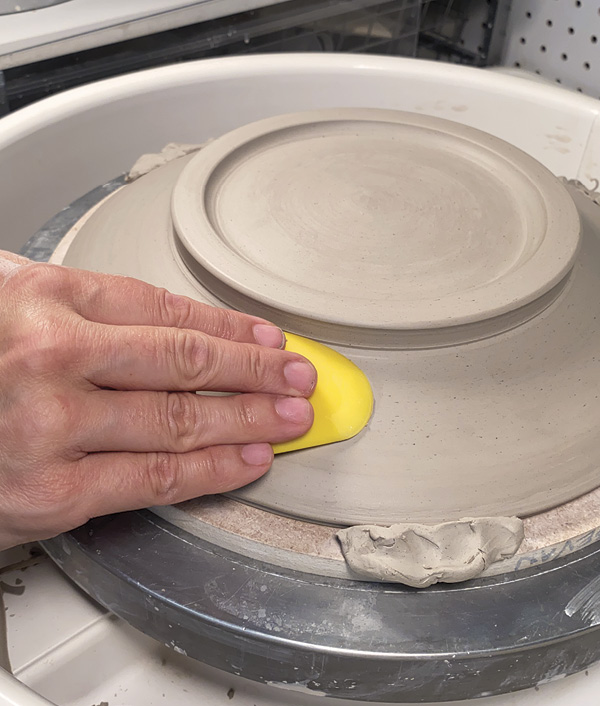 14 Smooth any imperfections with a flexible rubber rib.