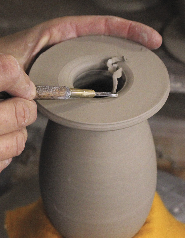 9 Trim the inside of the wall pocket rim and smooth with a rubber rib.