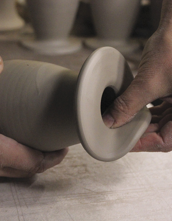 11 Bend up the rim to create the side that will hang on the wall.