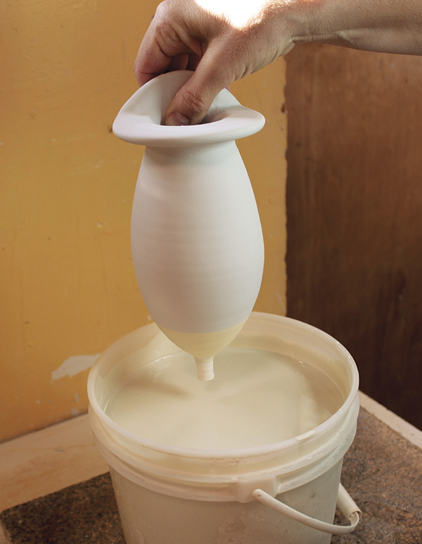 14 Wax the back. Dip the top in one color, then dip the bottom in another color.