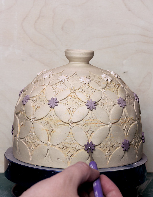 12 Attach the flower sprigs between the stamps, where they overlap.