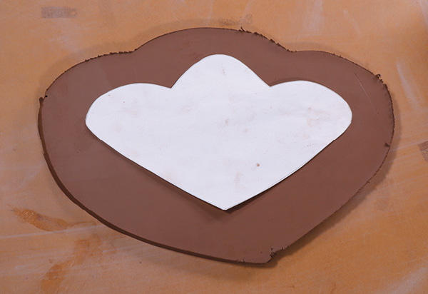 2 Cut a section of rolled and compressed slab approximately 2 inches larger than the template.