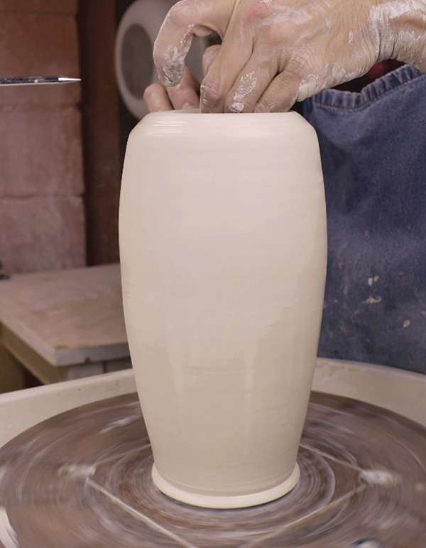 3 After bellying the walls, gently fold the top inch (2.5 cm) over to make a ledge.