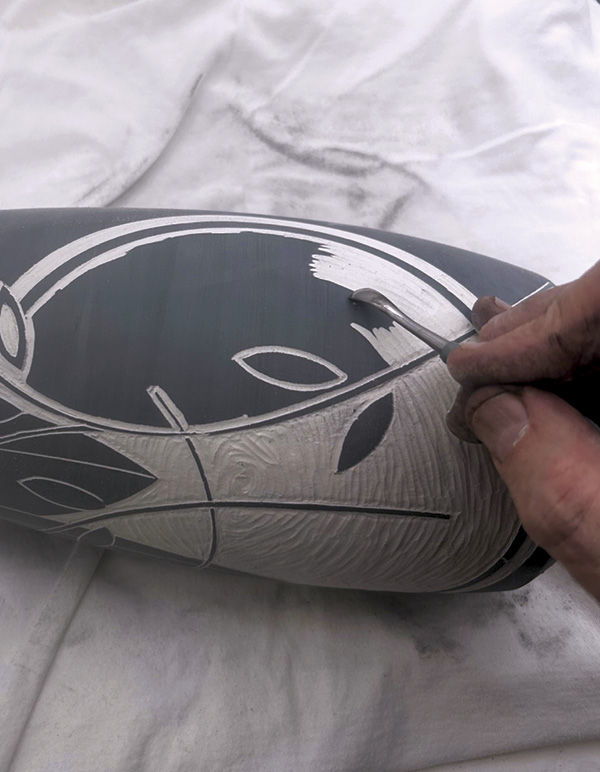 8 Use a scoop-shaped tool to remove terra sigillata and create texture.