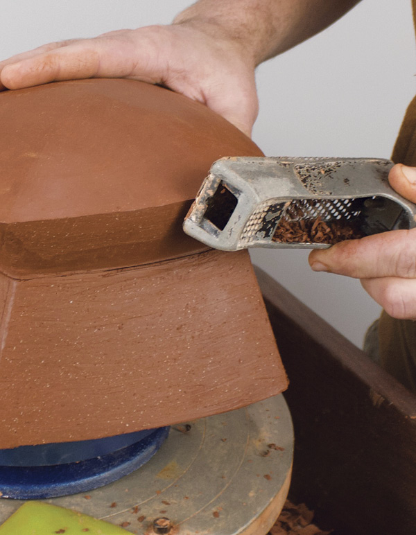 13 Use a Surform and metal rib to do the final refinements of the box’s shape.