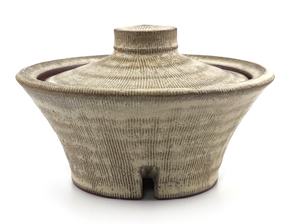 Brian Westrick's Salt cellar, 4½ in. (11.4 cm) in width, wheel thrown red stoneware, applied surface texture, poured white glaze, white liner glaze, fired in oxidation to cone 6, 2025.